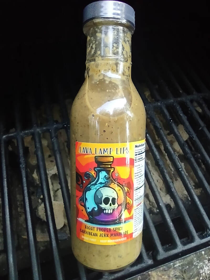 LAVA LAMP LIPS - Jerk marinade featuring local thyme, alliums, and chiles, plus allspice, ginger, and citrus. Bottle marinates 6 lbs protein. 12 fl oz.